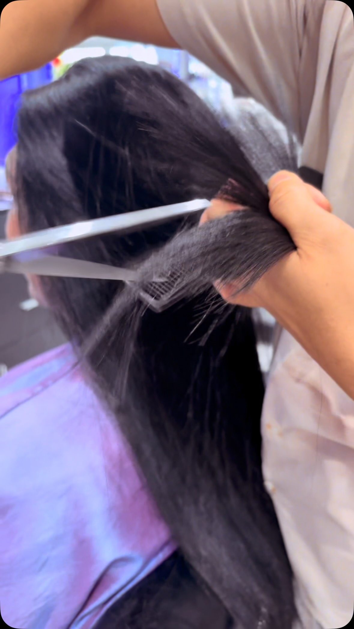 Long dark hair being styled at Phong Beauty Salon