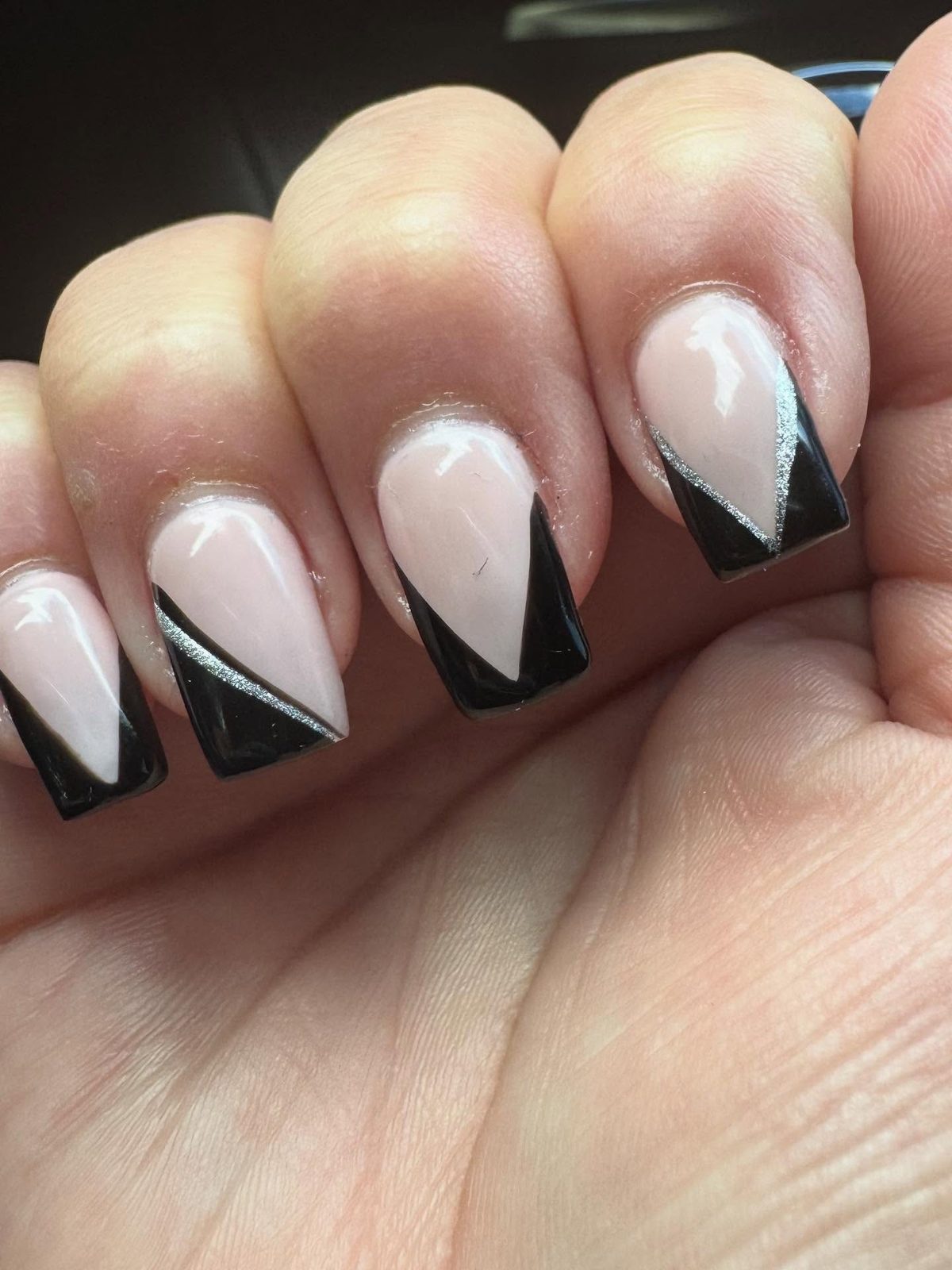 Black and nude French-tip manicure done at Phong Beauty Salon